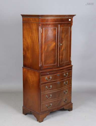 A modern reproduction mahogany tallboy, fitted with cupboard...