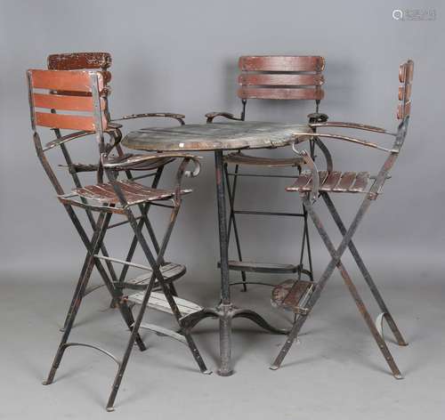 An early 20th century cast iron pub table, the tripod base d...