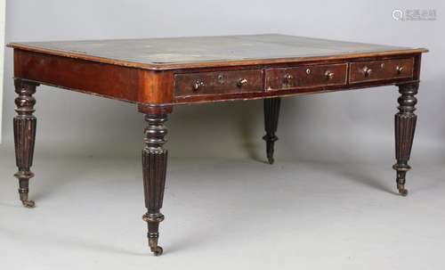 A William IV mahogany library table, fitted with six drawers...