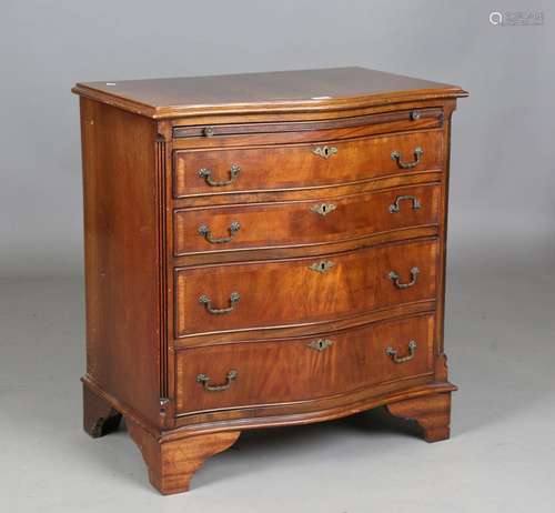 A 20th century reproduction mahogany serpentine fronted ches...