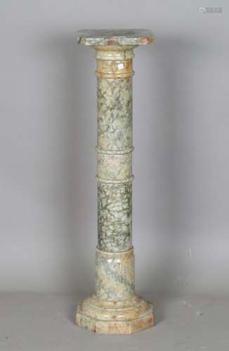 A mid-20th century green stained alabaster pedestal with can...