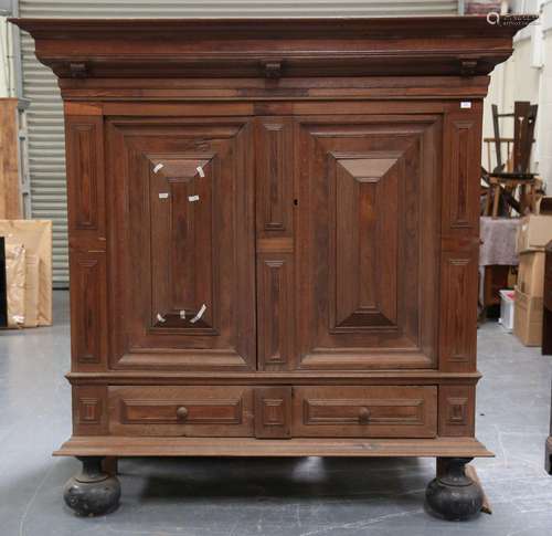 A 17th century Flemish oak and walnut veneered cupboard, the...