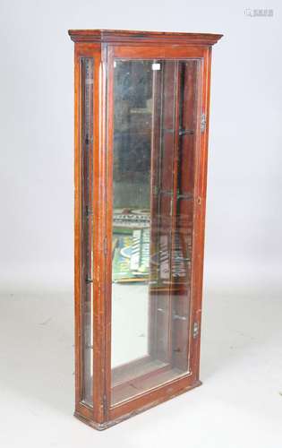 A late Victorian mahogany wall mounted shop display cabinet,...