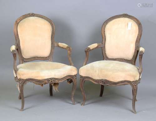 A pair of 19th century French walnut showframe fauteuil armc...