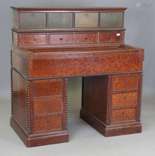 A 19th century Continental 'plum pudding' mahogany twin pede...