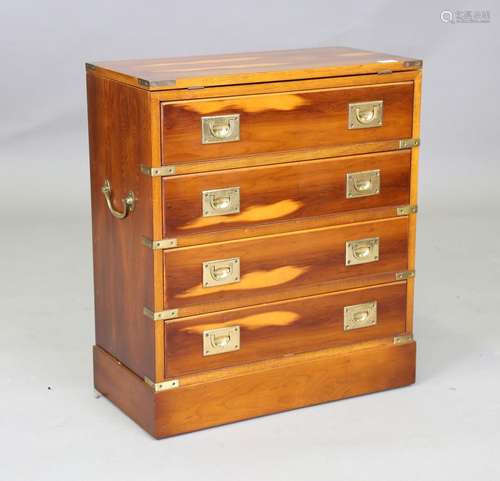 A modern yew campaign style bachelor's chest, the hinged top...