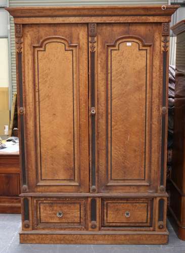 A late Victorian bird's eye maple wardrobe, fitted with a pa...