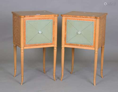 A pair of late 20th century French satinwood bedside cabinet...