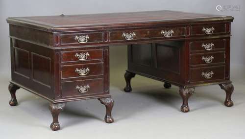 An early 20th century mahogany twin pedestal desk, fitted wi...