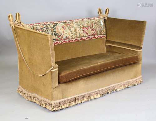 An early/mid-20th century Knole settee, upholstered in green...