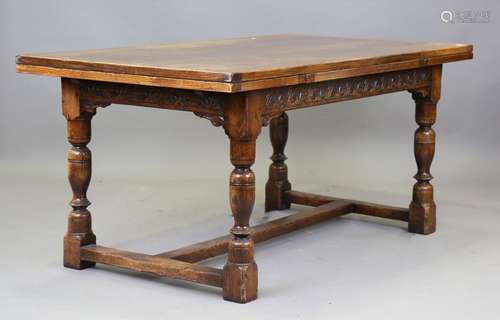 A 20th century Jacobean Revival oak dining room suite, compr...