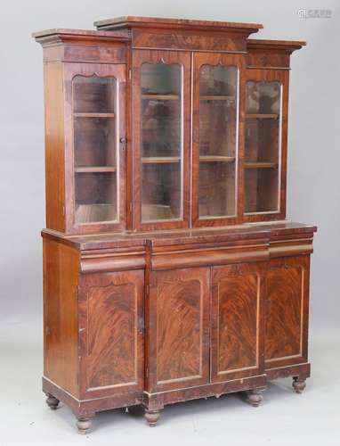 A Victorian mahogany breakfront bookcase cabinet, fitted wit...