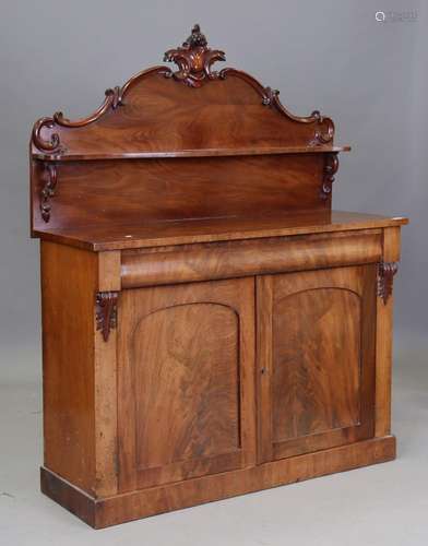 A late Victorian mahogany chiffonier, the shaped back above ...