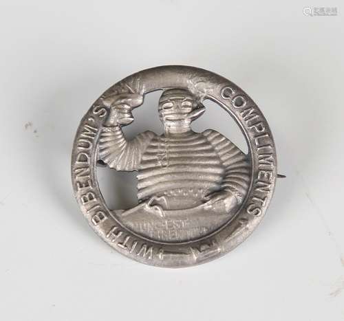 A 'With Bibendum's Compliments' cast metal advertising pin b...