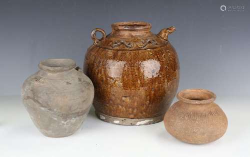 A pair of Chinese saltglaze stoneware water vessels of globu...