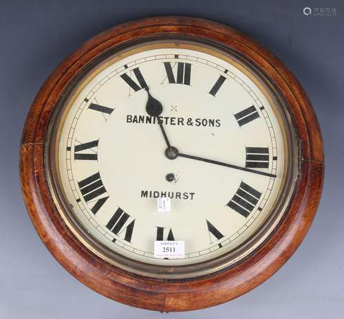 An early 20th century beech framed circular wall timepiece