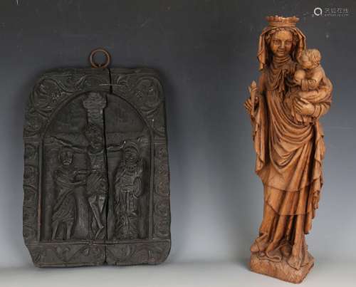 A 20th century carved elm figure group of the Madonna and Ch...