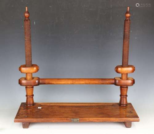 An early 20th century elm and fruitwood bookmaker's press by...