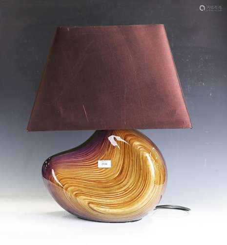 A modern lacquered and carved ply table lamp by Christian Wa...