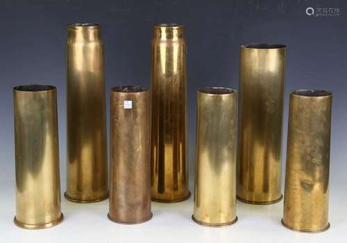 A group of seven brass military shell cases