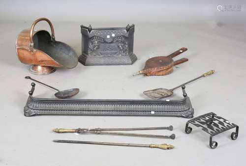 A set of three Victorian steel fire tools with cast brass ha...