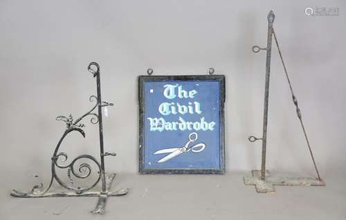 An early 20th century double-sided hanging wooden sign