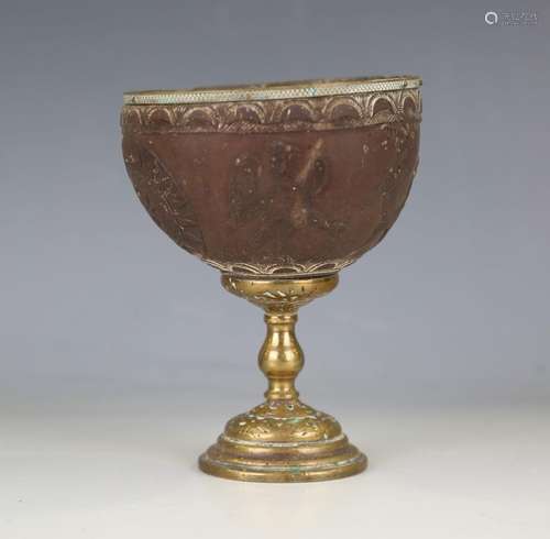 A late 18th/early 19th century brass mounted coconut goblet