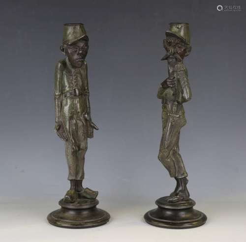 A pair of 20th century green patinated metal figural candles...