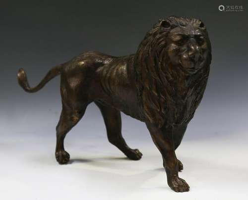 A modern brown patinated cast bronze model of a lion