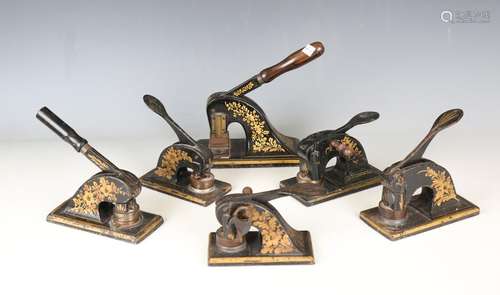 Six late 19th century cast iron paper desk presses