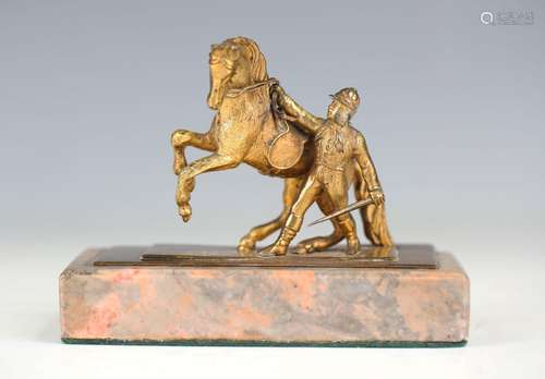 A late 19th century cast gilt bronze equestrian group