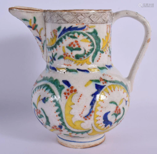 AN OTTOMAN TURKISH KUTAHYA HOLY WATER JUG painted with motif...