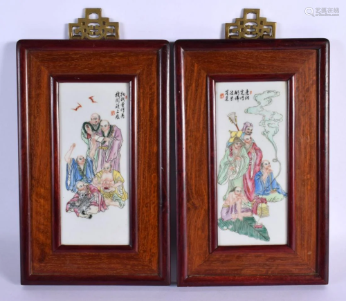 A PAIR OF CHINESE FAMILLE ROSE PORCELAIN AND HARDWOOD PLAQUE...