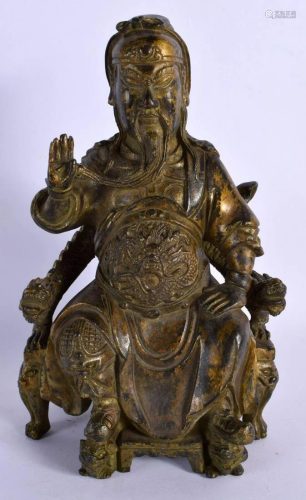 A CHINESE BRONZE FIGURE OF A SEATED GUARDIAN 20th Century. 2...