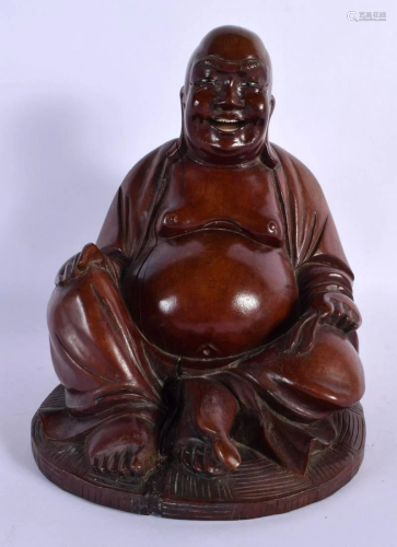 A 19TH CENTURY CHINESE CARVED ROOTWOOD FIGURE OF A BUDDHA mo...