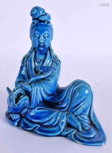 A 19TH CENTURY CHINESE BLUE GLAZED FIGURE OF AN IMMORTAL Lat...