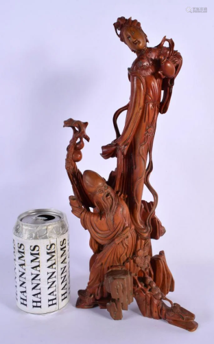 A 19TH CENTURY CHINESE CARVED WOOD FIGURAL GROUP modelled as...