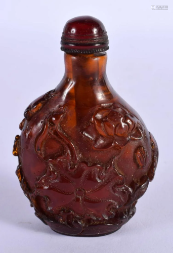 A CHINESE CARVED AMBER SNUFF BOTTLE 20th Century. 65 grams. ...