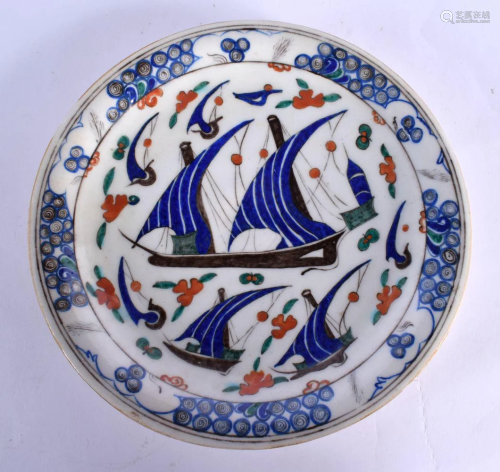 A TURKISH MIDDLE EASTERN FAIENCE DISH painted with boats. 27...