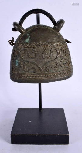 AN EARLY MIDDLE EASTERN TRIBAL BELL. 22 cm high.