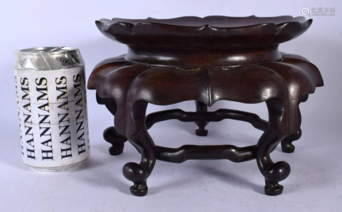 AN EARLY 20TH CENTURY CHINESE CARVED HARDWOOD STAND of natur...