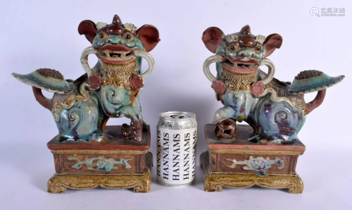 A PAIR OF LATE 19TH CENTURY CHINESE ENAMELLED POTTERY BUDDHI...