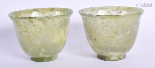 A PAIR OF EARLY 20TH CENTURY CHINESE CARVED JADE TEABOWLS La...