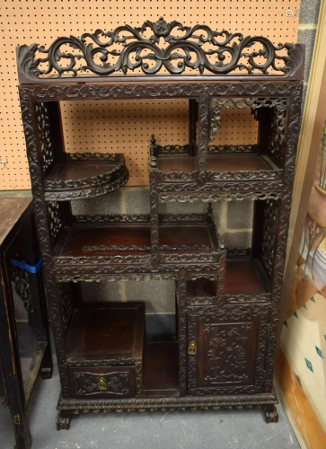 A 19TH CENTURY CHINESE CARVED HONGMU HARDWOOD DISPLAY CABINE...
