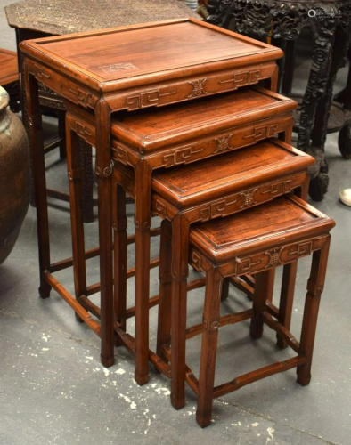 A NEST OF FOUR LATE 19TH CENTURY CHINESE HARDWOOD TABLES. La...