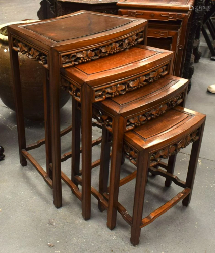 A NEST OF FOUR EARLY 20TH CENTURY CHINESE HARDWOOD TABLES La...