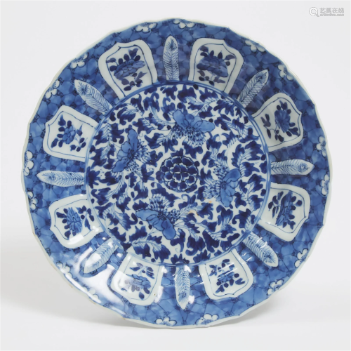 A Moulded Blue and White Barbed-Rim Dish, Kangxi Period (16