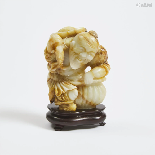 A White and Russet Jade Figure of a Fisherman, Late Qing/Re