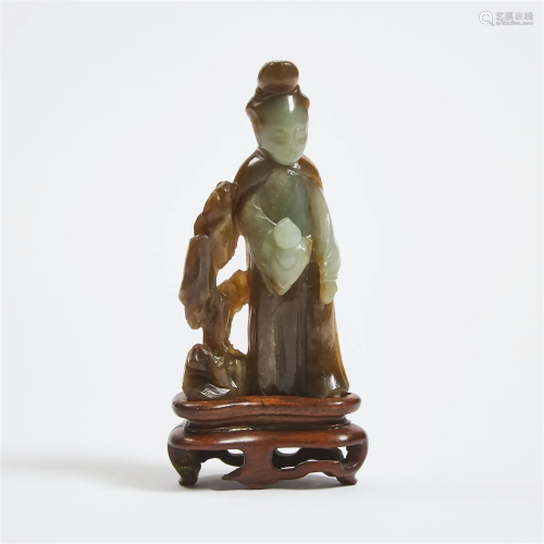A Celadon and Russet Jade Figure of Magu, Late Ming/Early Q