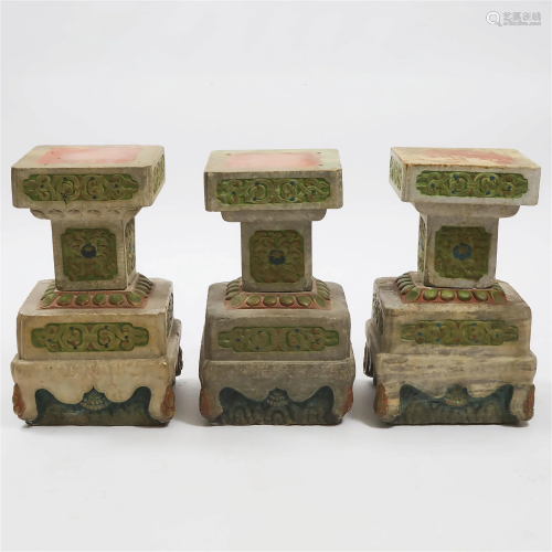 A Set of Three Carved and Polychromed White Marble Pedestal
